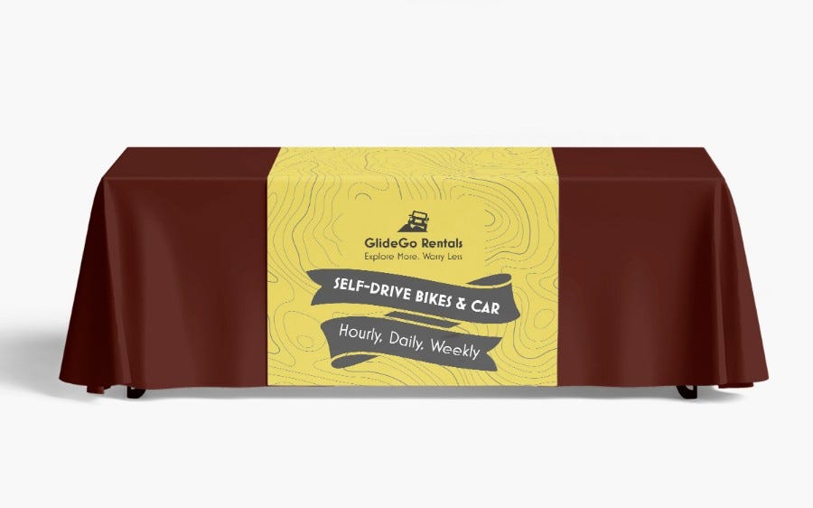 Custom printed table runner draped across an event table